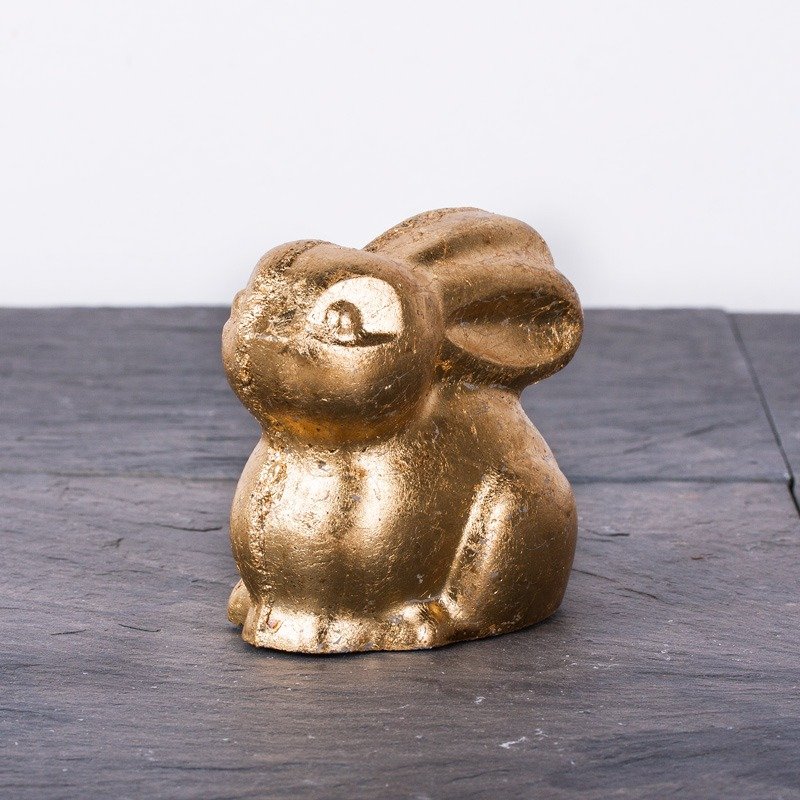 Golden rabbit out of creative-cement