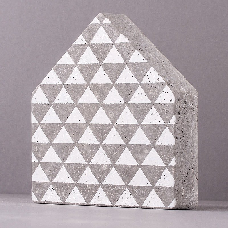 Cement-house  with stencilled triangles