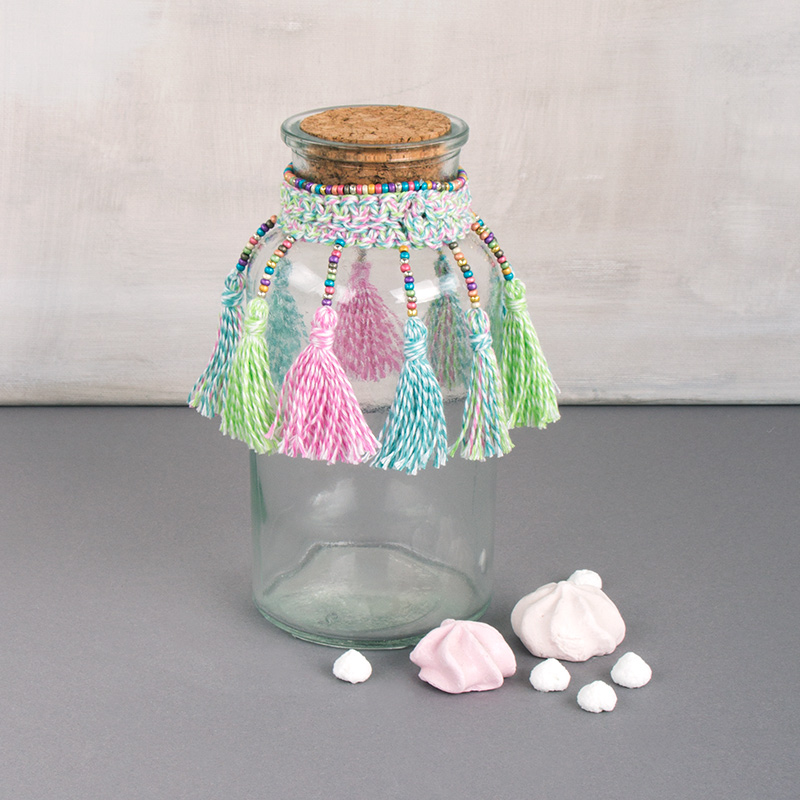 Glass jar with tassels