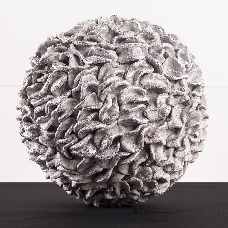 Small kneading-cement ball in folded optics