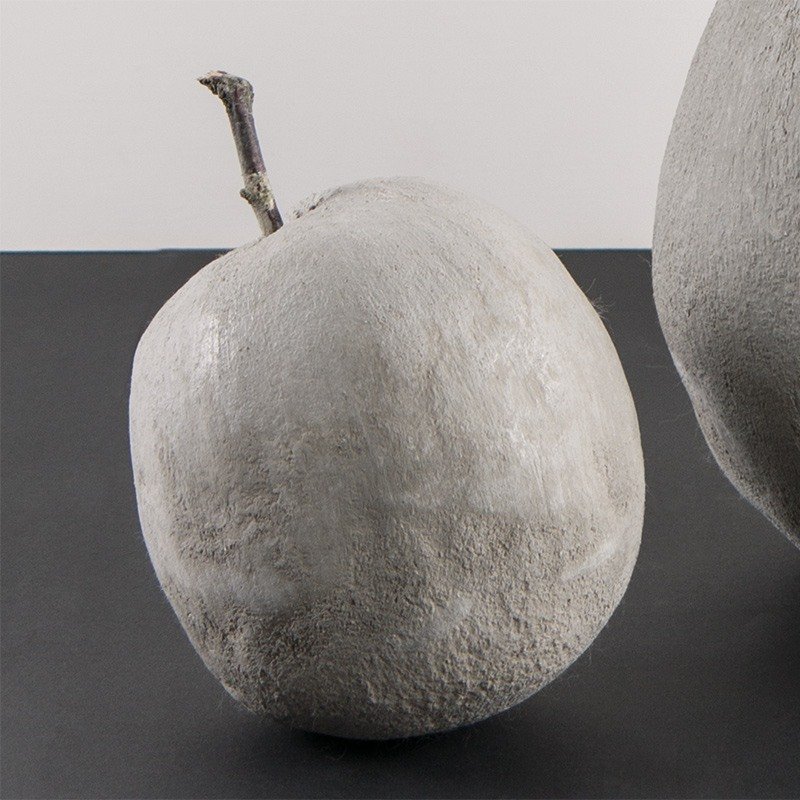 Small apple out  of the kneading-cement