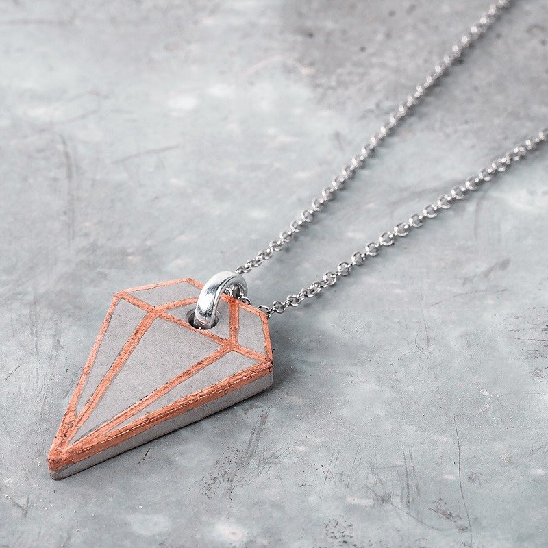 Copper-coloured diamond-shaped jewellery pendant