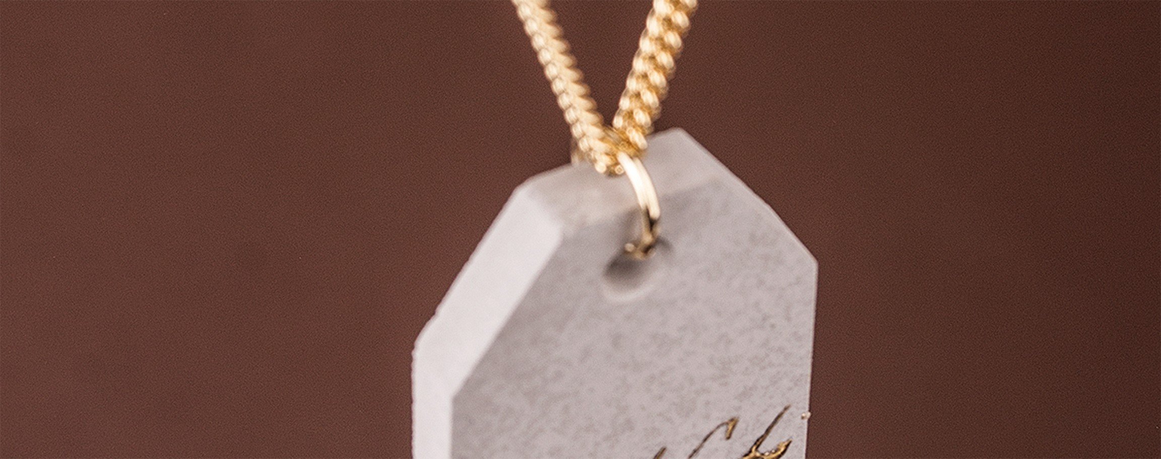 Jewellery pendant tag with gold lettering