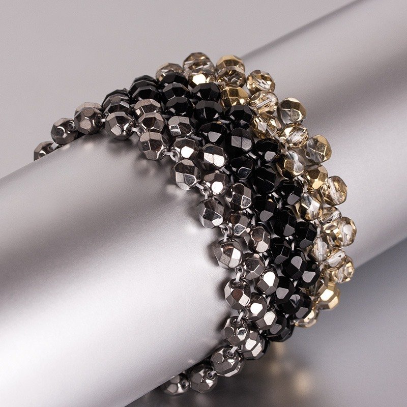 Schwarz-goldfarbenes, breites Armband