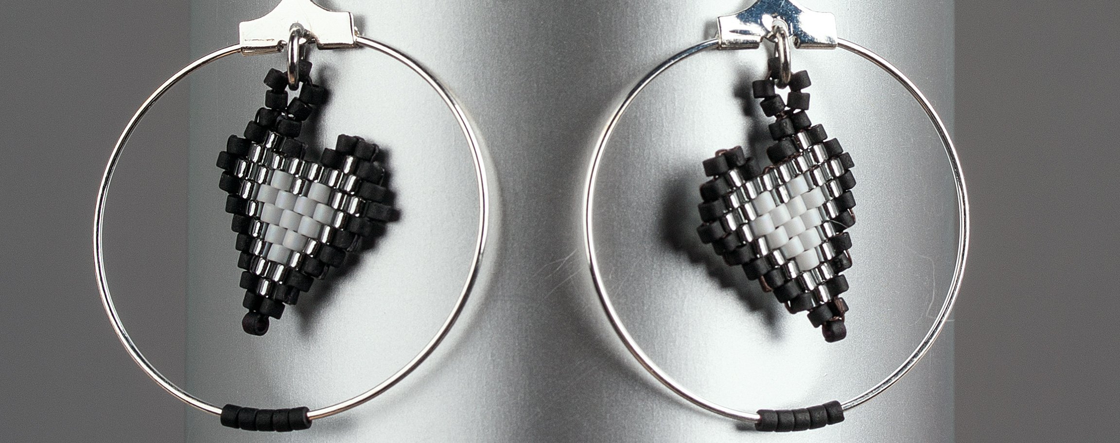Black earrings with Miyuki heart-shaped pendants