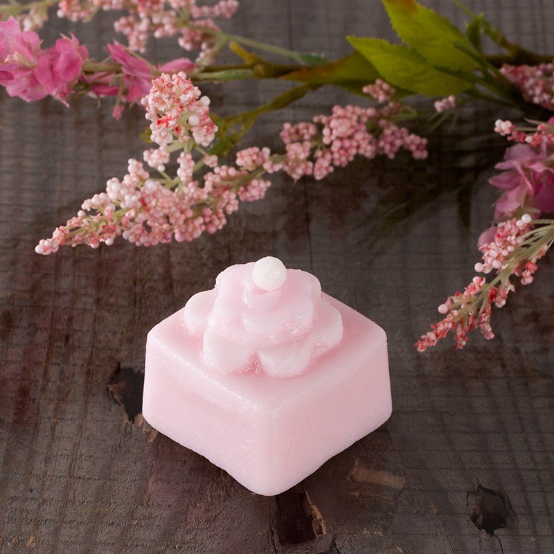Pink rectangular soap with flower-shaped cookie cutter